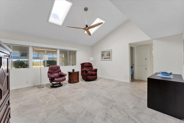 3685 Vista Campana N Unit 56, Oceanside, CA 92057 - living area featuring a skylight, high vaulted ceiling, and ceiling fan