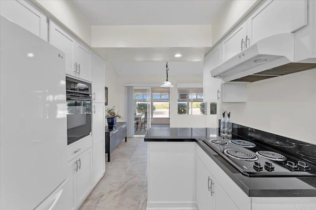 kitchen featuring kitchen peninsula, white cabinetry, pendant lighting, and black appliances