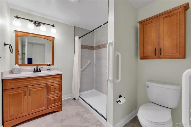 bathroom featuring curtained shower, vanity, and toilet