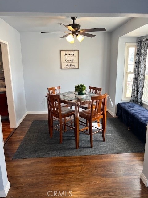 dining space featuring dark hardwood / wood-style floors and ceiling fan