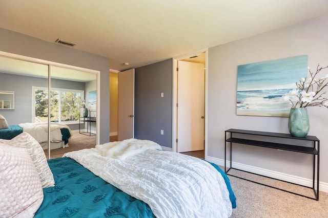 bedroom with a closet and carpet