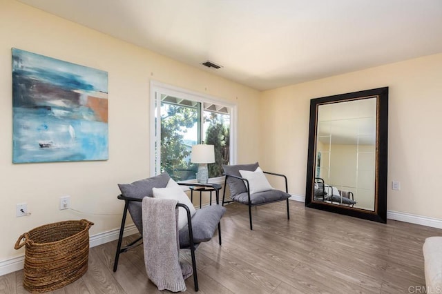 sitting room featuring hardwood / wood-style flooring