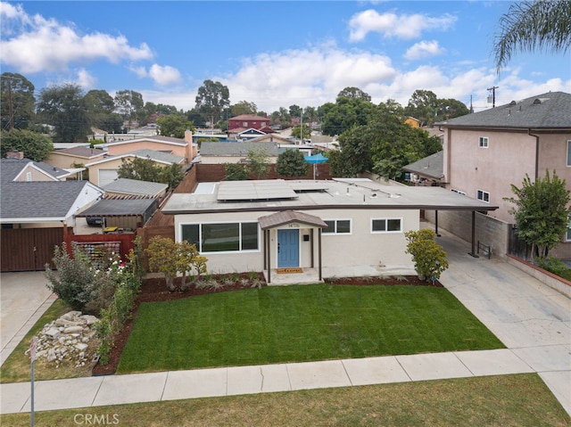 view of front of house with a front lawn and a carport