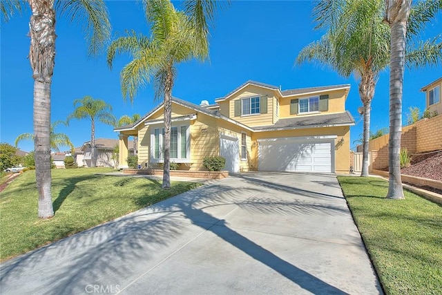 view of front of home with a front lawn and a garage