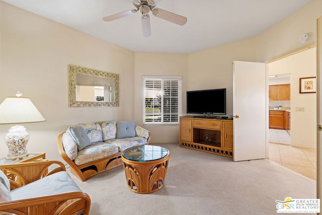 living room featuring light carpet and ceiling fan