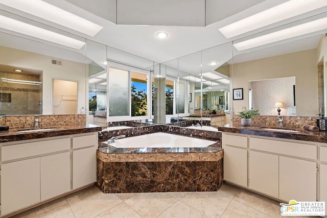 bathroom with separate shower and tub, backsplash, tile patterned flooring, and vanity