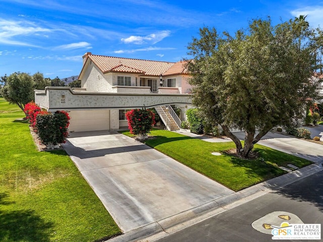 view of front facade with a garage and a front yard