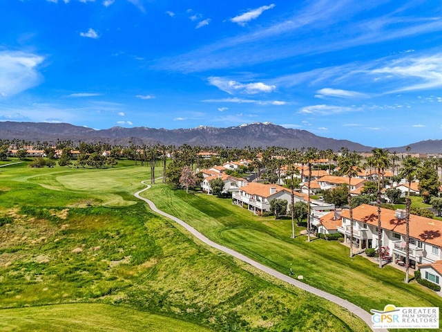 birds eye view of property with a mountain view