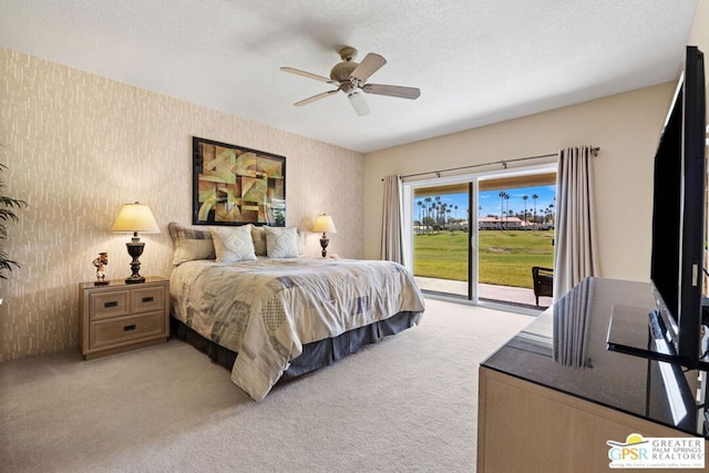 bedroom with access to outside, ceiling fan, light carpet, and a textured ceiling