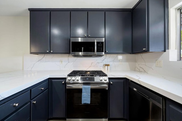 kitchen with decorative backsplash, stainless steel appliances, and light stone counters