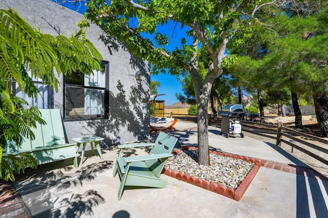 surrounding community with a patio area