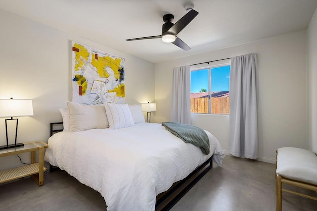 bedroom with concrete flooring and ceiling fan