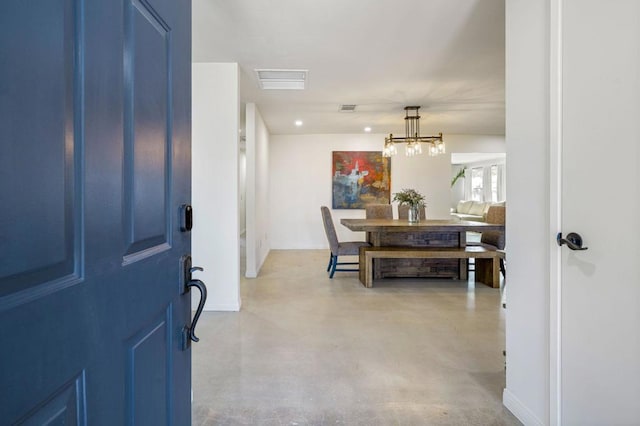 entryway featuring an inviting chandelier