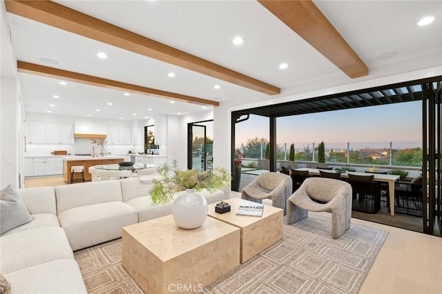 living room featuring beam ceiling