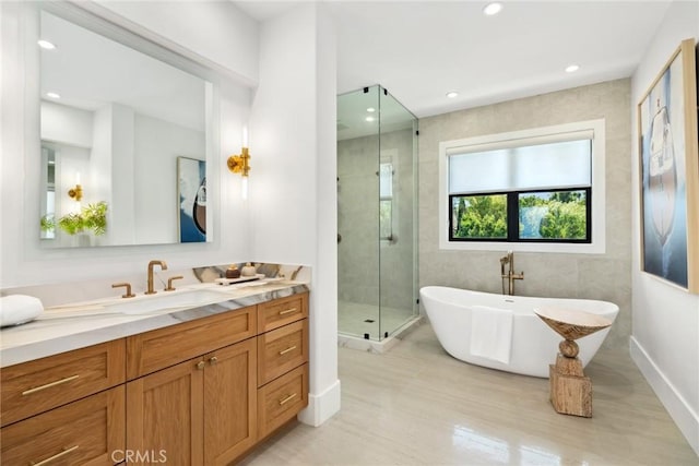 bathroom with vanity, wood-type flooring, and plus walk in shower