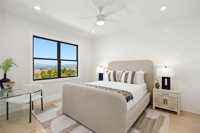 bedroom featuring ceiling fan and light hardwood / wood-style flooring