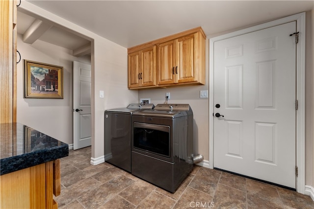 washroom featuring independent washer and dryer and cabinets