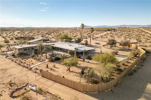 birds eye view of property with a mountain view