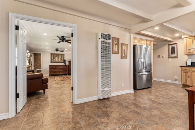 kitchen featuring light brown cabinets, stainless steel fridge, and ceiling fan