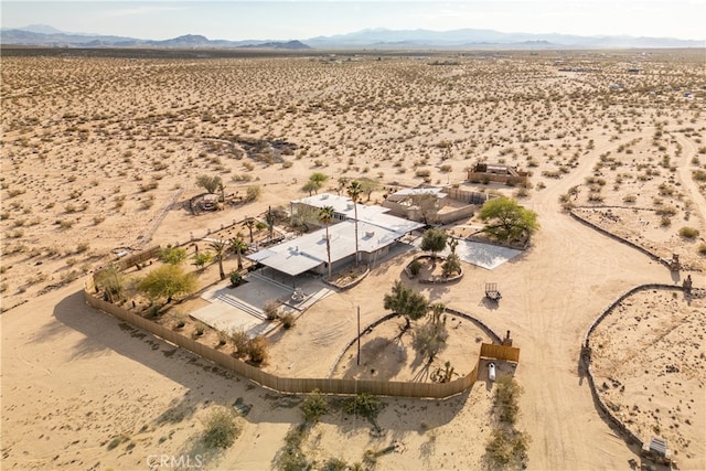 birds eye view of property featuring a mountain view