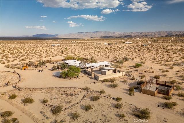 birds eye view of property featuring a mountain view