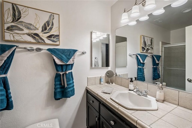 bathroom with vanity and walk in shower