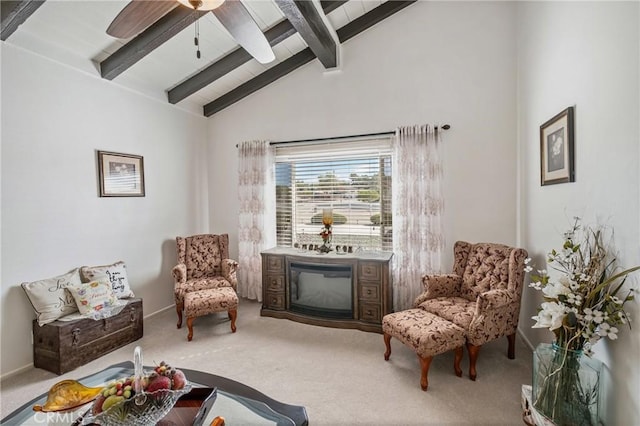 living area featuring carpet flooring, beam ceiling, and high vaulted ceiling