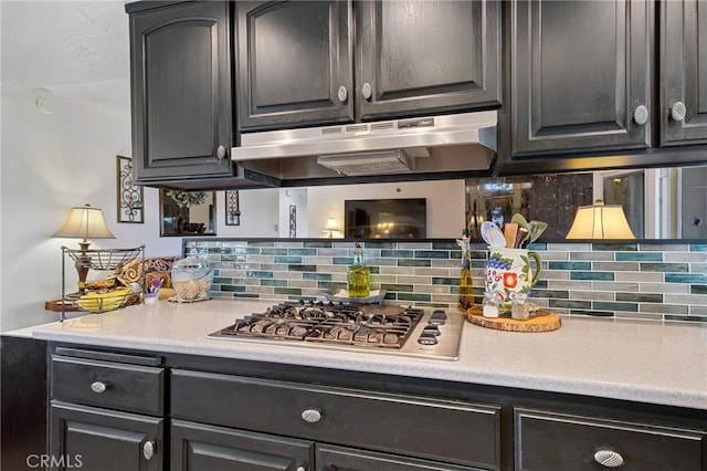 kitchen with backsplash and stainless steel gas stovetop