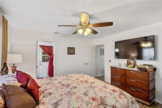 bedroom featuring ceiling fan and hardwood / wood-style flooring