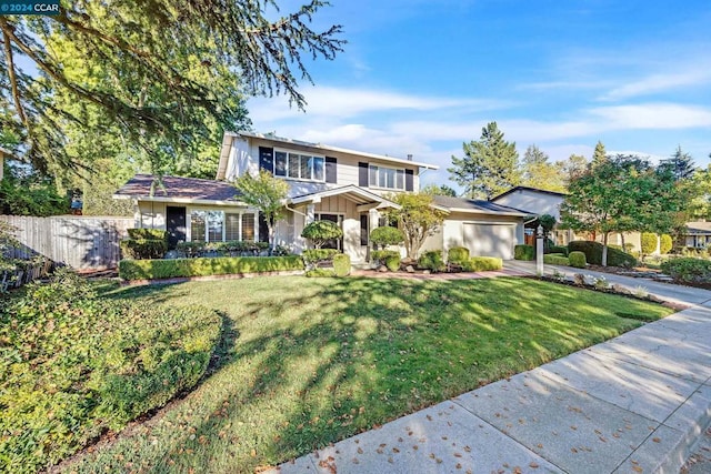 view of front facade featuring a garage and a front lawn