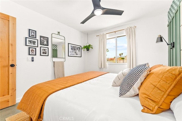 carpeted bedroom with ceiling fan