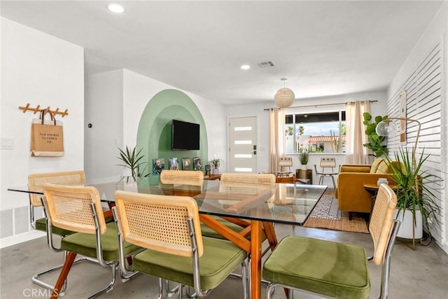 dining room with concrete flooring