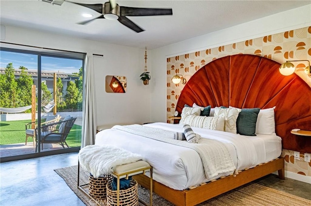 bedroom featuring ceiling fan, access to outside, and concrete floors