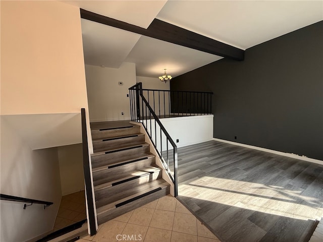 staircase with tile patterned flooring, beamed ceiling, and an inviting chandelier