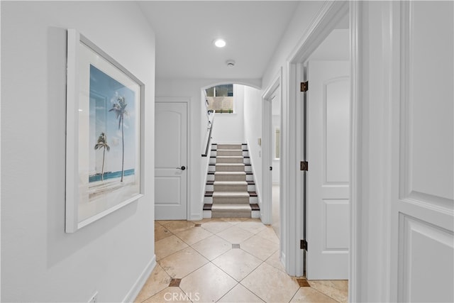 corridor with light tile patterned floors