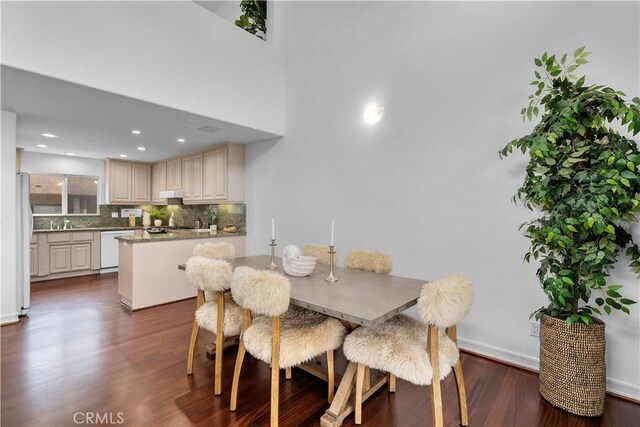 dining space featuring dark hardwood / wood-style flooring