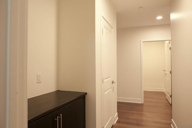 hallway with wood-type flooring