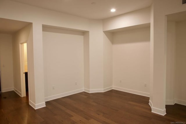 unfurnished room featuring dark hardwood / wood-style floors