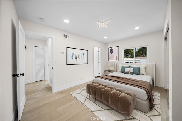 bedroom with light hardwood / wood-style floors