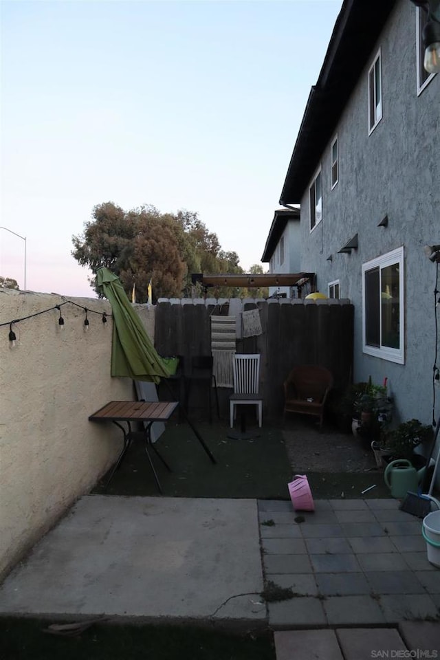 view of patio terrace at dusk