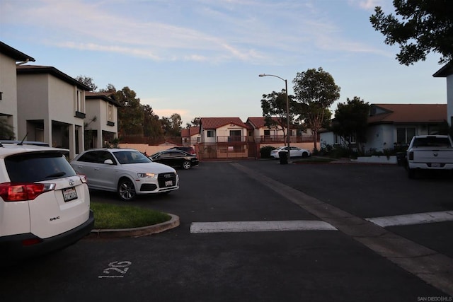 view of parking at dusk