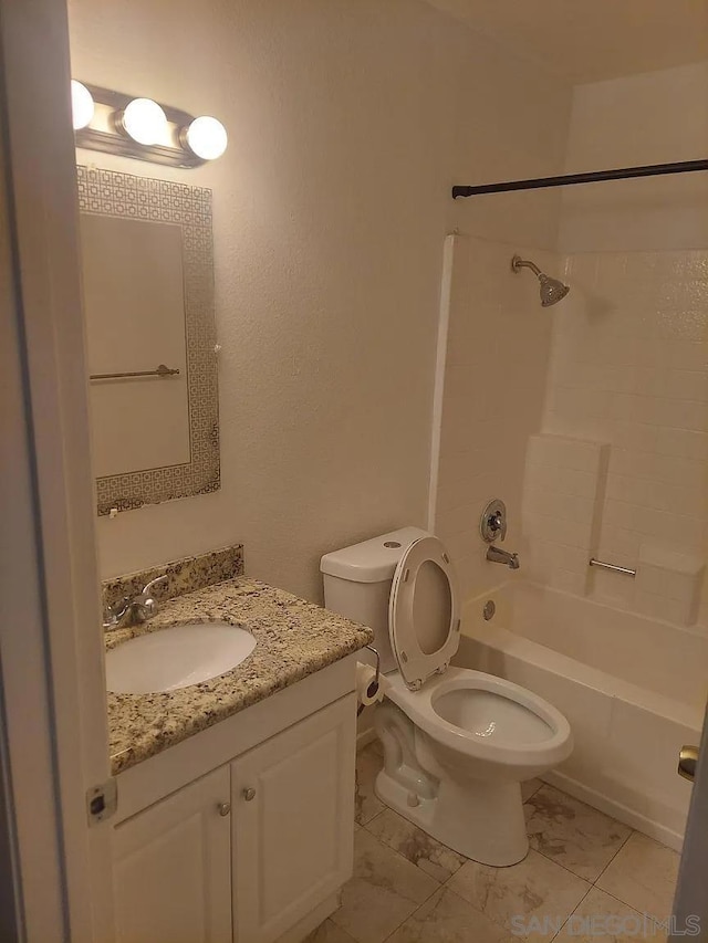 full bathroom with washtub / shower combination, vanity, and toilet