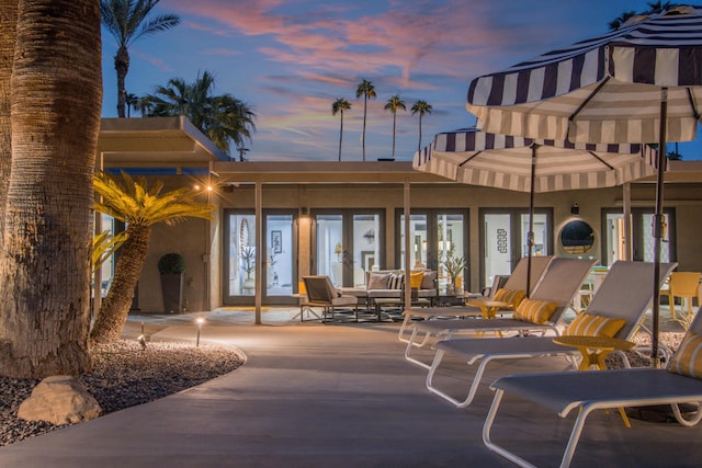 view of patio terrace at dusk