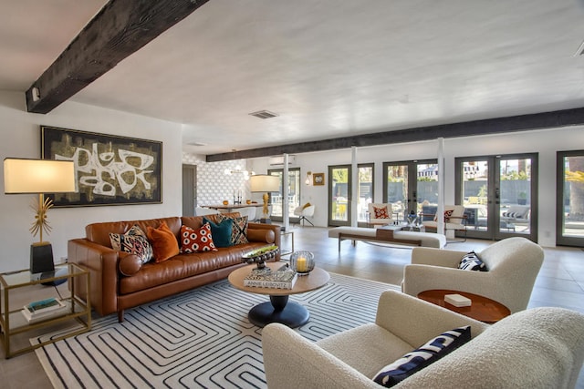 tiled living room featuring french doors