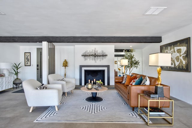 living room featuring beamed ceiling and concrete floors