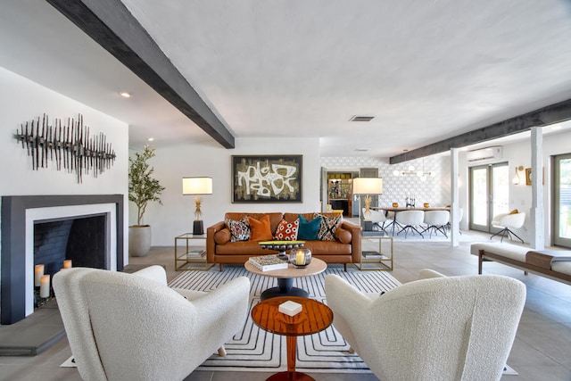 living room with a wall unit AC and beamed ceiling