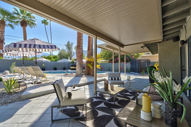 view of patio with a fenced in pool