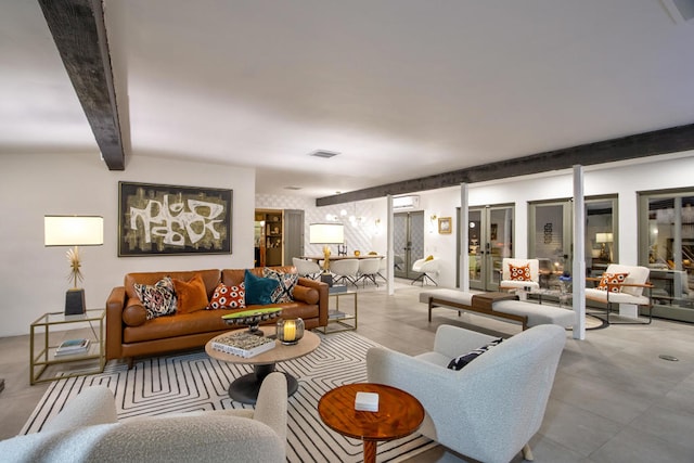 living room featuring an AC wall unit and beam ceiling