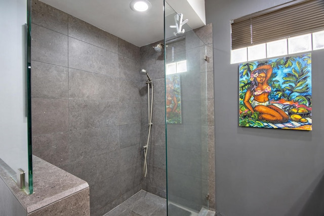 bathroom featuring tiled shower