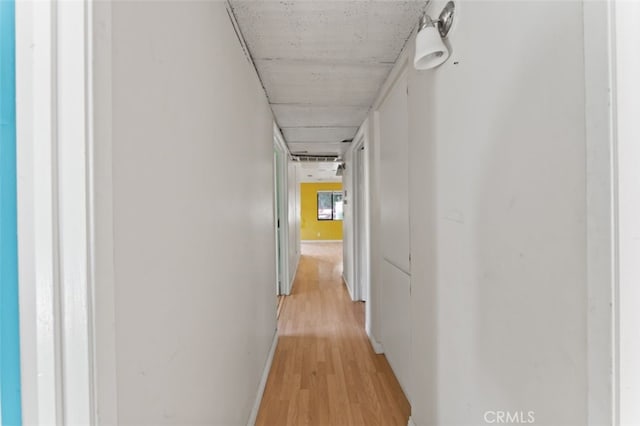 corridor featuring light hardwood / wood-style floors